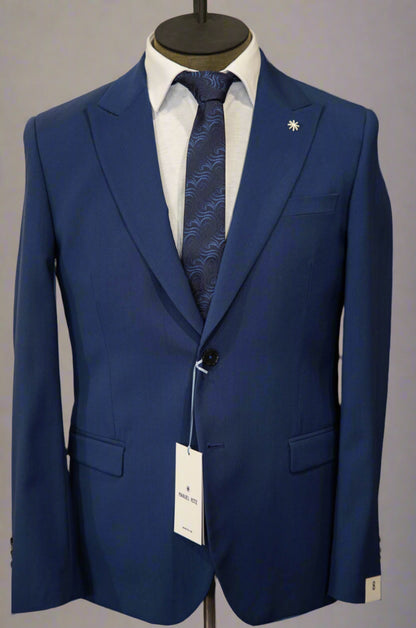 "Manuel Ritz blue suit with a tonal blue tie in Ultimo Euromoda store."
