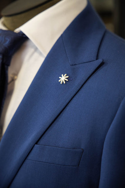 "Manuel Ritz blue suit with a tonal blue tie in Ultimo Euromoda store."