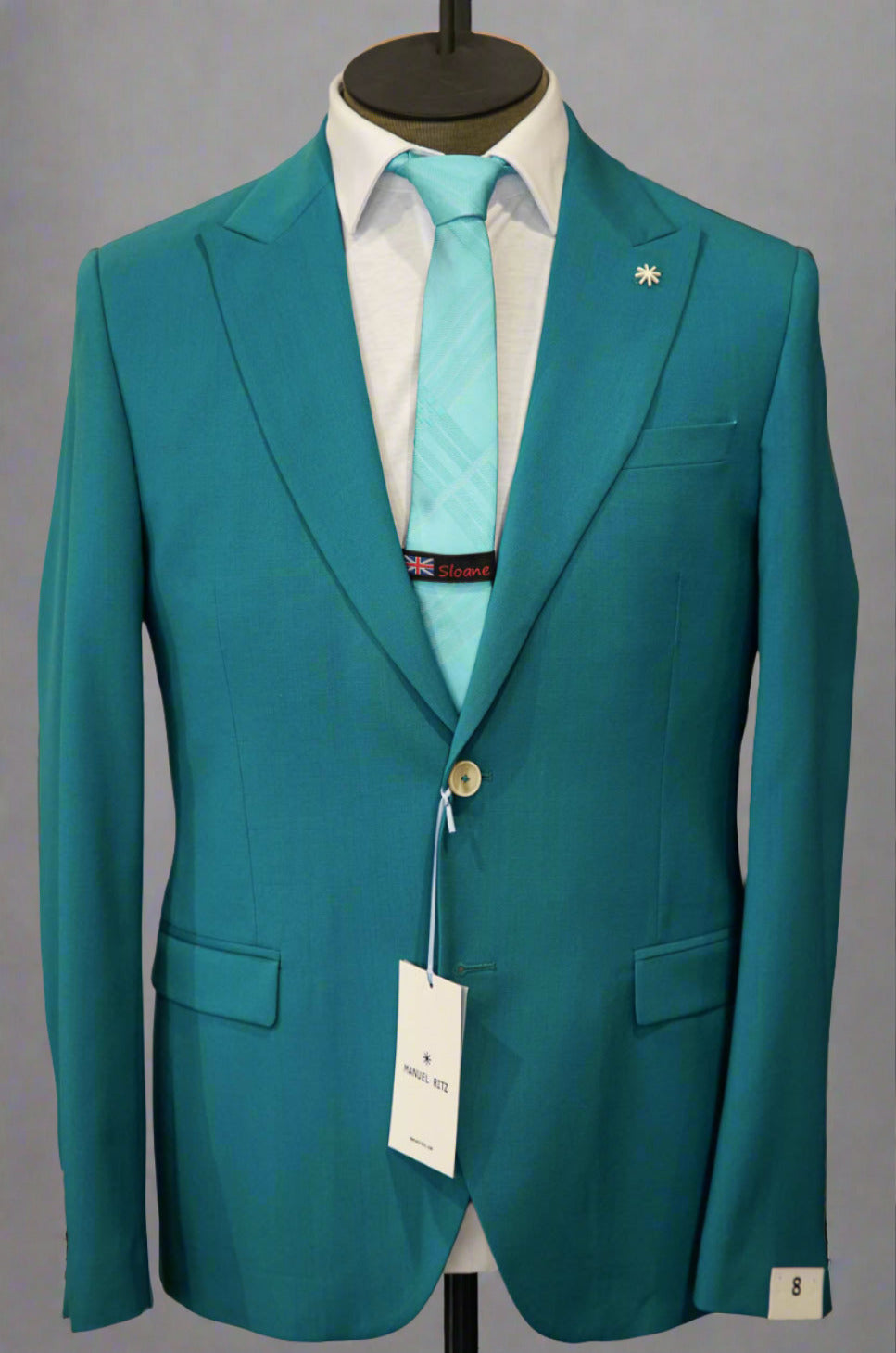 Manuel Ritz teal suit with a tonal teal paisley tie in Ultimo Euromoda store.